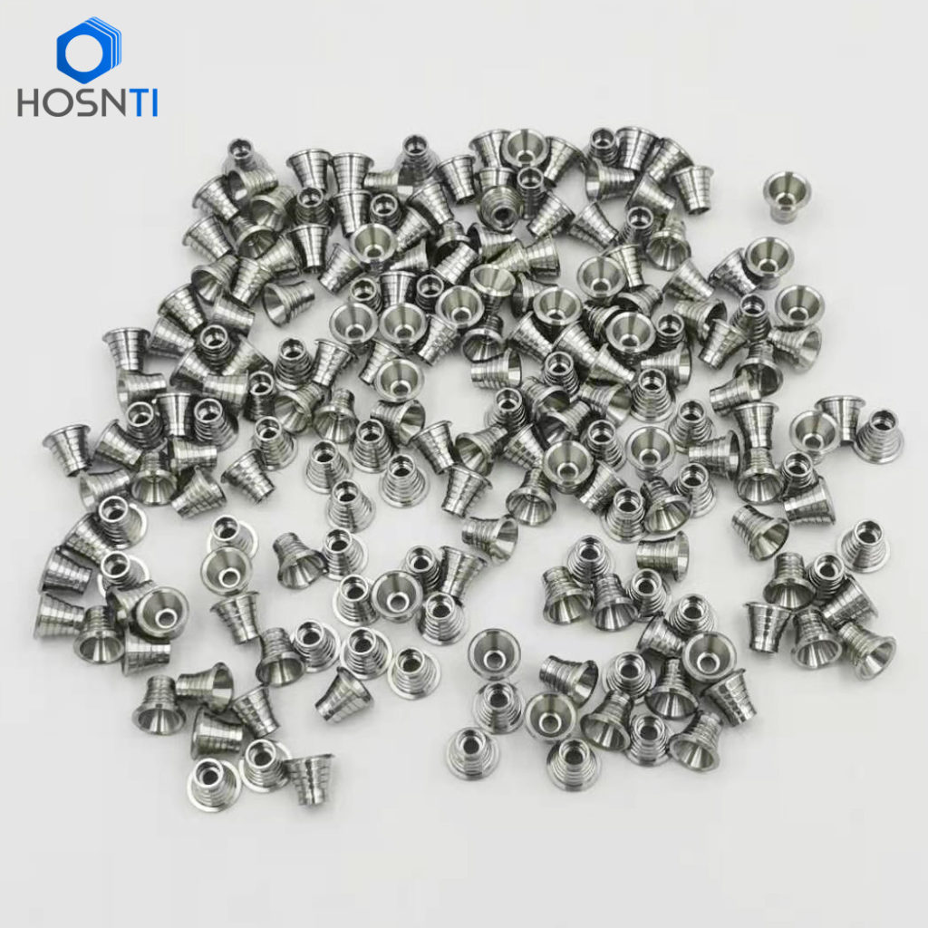 Small precision titanium parts machined from swiss type lathes